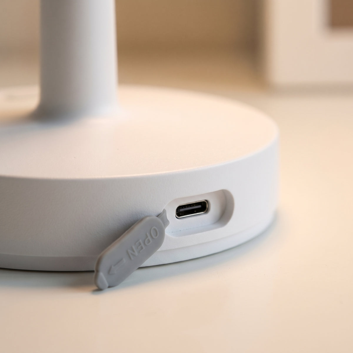 Rubber cover folded back to show the USB-C charging port
